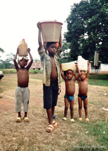 children_carrying_water-nyong-river-cameroon.65140922_std